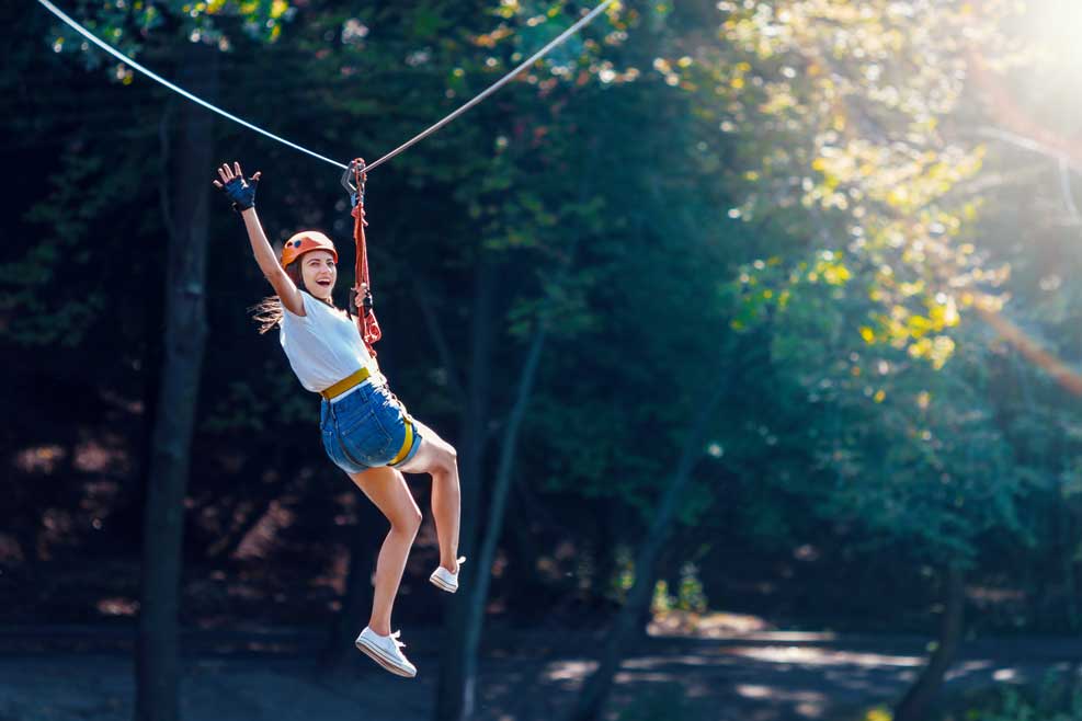 Woman on Zipline at an Adventure Park